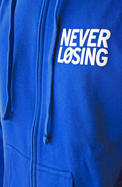 Stay Winning Never Losing Kapuzenpullover mit Reißverschluss in Königsblau/Weiß